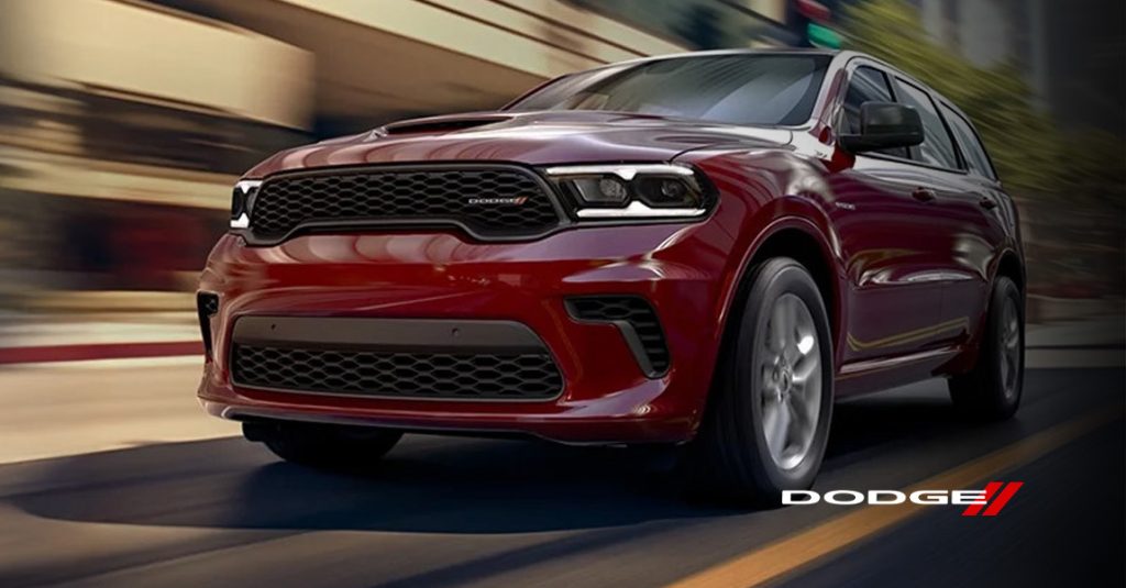 a red 2026  Dodge Durango drives down a road in Medina, OH